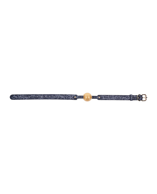 The Sportsheets Cougar Ball Gag laid flat. The cougar print of the leather can be viewed even from this far away distance. | Kinkly Shop