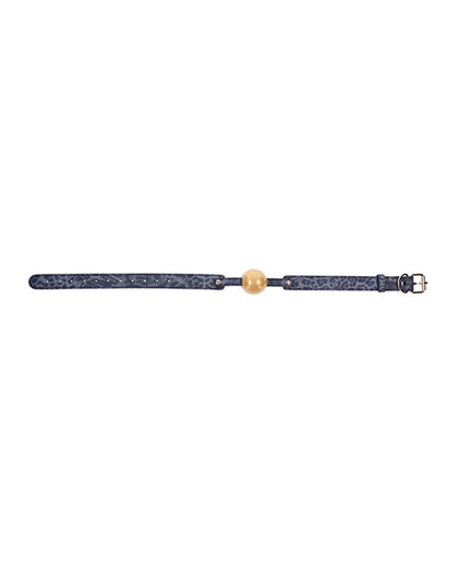 The Sportsheets Cougar Ball Gag laid flat. The cougar print of the leather can be viewed even from this far away distance. | Kinkly Shop