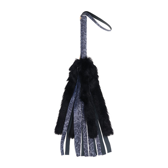 The Sportsheets Cougar Faux Fur Flogger in front of a plain white background | Kinkly Shop