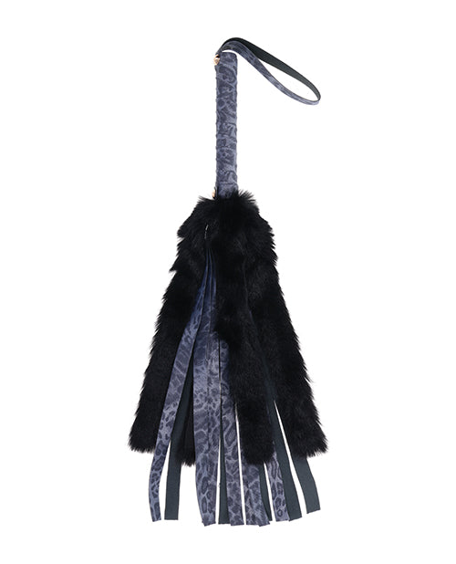 The Sportsheets Cougar Faux Fur Flogger in front of a plain white background | Kinkly Shop