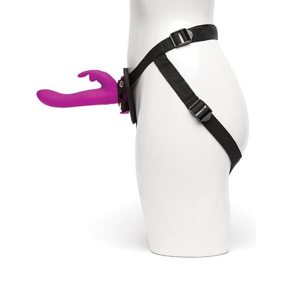 Side view of the person wearing the Happy Rabbit Strap On Harness Set. The rabbit vibrator protrudes very far from the base of the harness. | Kinkly Shop