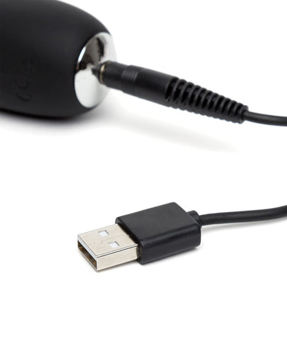 Close-up of the charging cable which is a pin-style charger that plugs into the base of the Happy Rabbit Slimline G-spot | Kinkly Shop