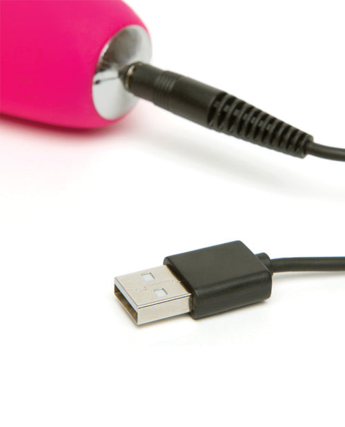 Close-up on the charging cable plugged into the very base of the Happy Rabbit Slimline Curve. It's a pin-style charger that has to slide inside the toy. | Kinkly Shop