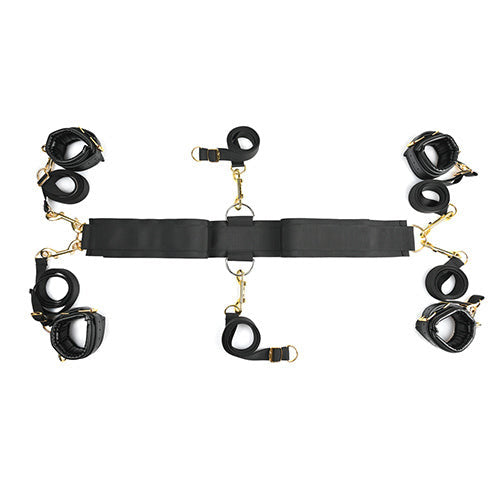 The Sportsheets Under The Bed Restraint System - Special Edition laid flat in front of a plain white background, showcasing the design of the full six bondage straps. | Kinkly Shop