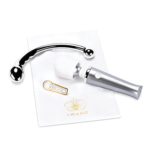 Everything included in the Le Wand Mini Pleasures Kit including the mini wand, stainless steel dildo, pin, and satin storage pouch. | Kinkly SHop