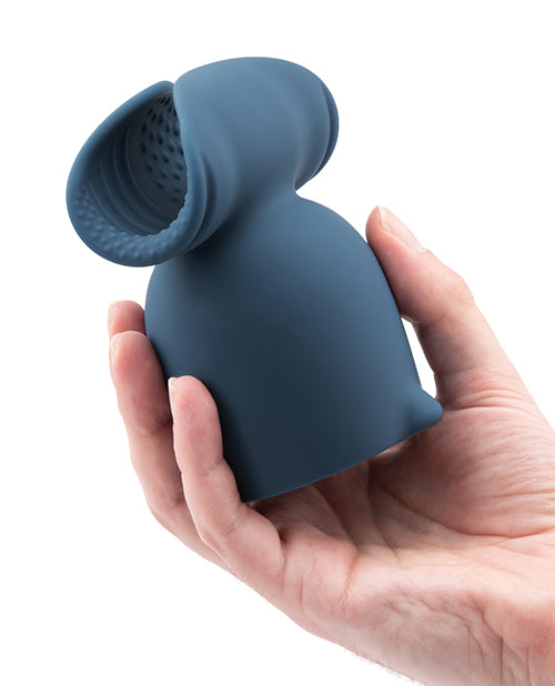 A hand holds the Le Wand Stroke Attachment. The attachment looks particularly large in their hand. | Kinkly Shop
