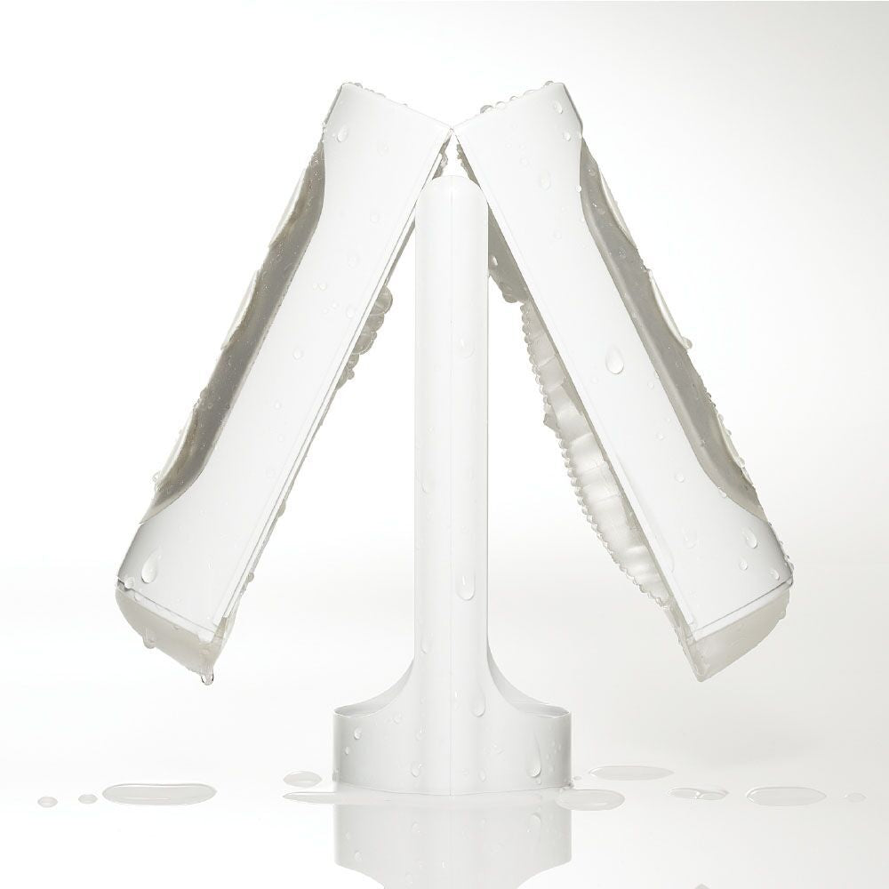 The Tenga Flip Hole is open in the middle, resting on top of its stand, showcasing how the included stand helps the stroker dry. | Kinkly Shop