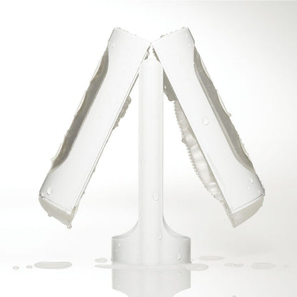 The Tenga Flip Hole is open in the middle, resting on top of its stand, showcasing how the included stand helps the stroker dry. | Kinkly Shop