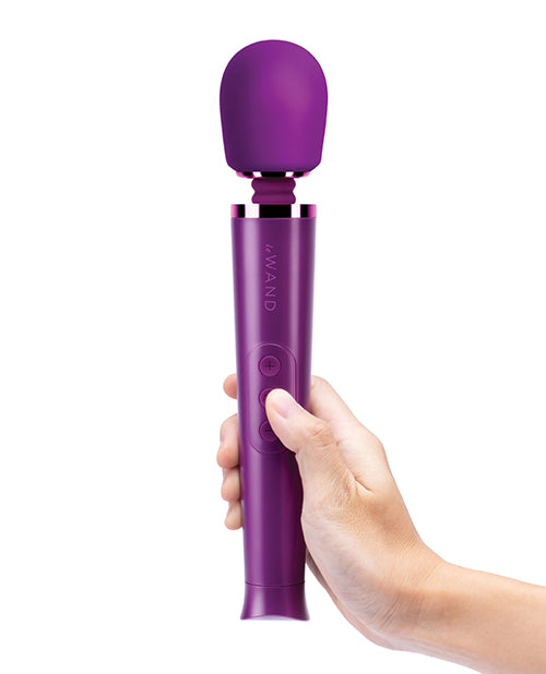 A hand holds the Le Wand Petite Rechargeable in Cherry | Kinkly Shop