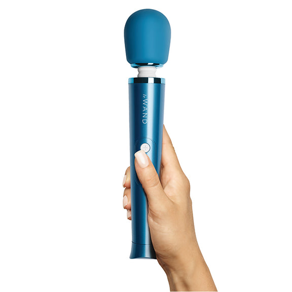 A hand holds the Le Wand Petite Rechargeable in Blue | Kinkly Shop