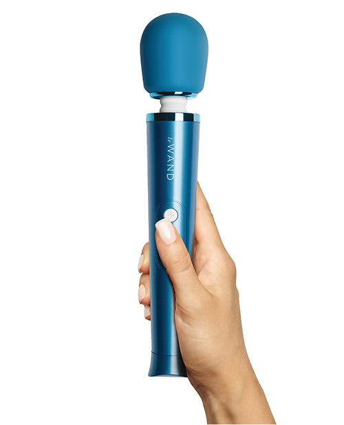 A hand holds the Le Wand Petite Rechargeable in Blue | Kinkly Shop