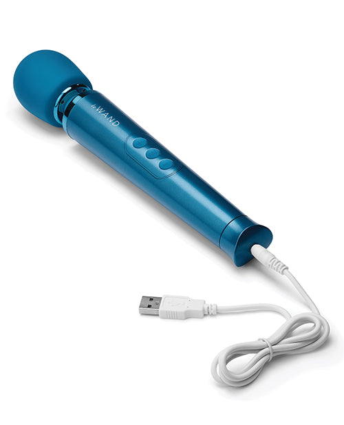 Close-up on the base of the Le Wand Petite Rechargeable with a charging cable plugged into the wand. The opposite end of the charging cable has a USB port. | Kinkly Shop