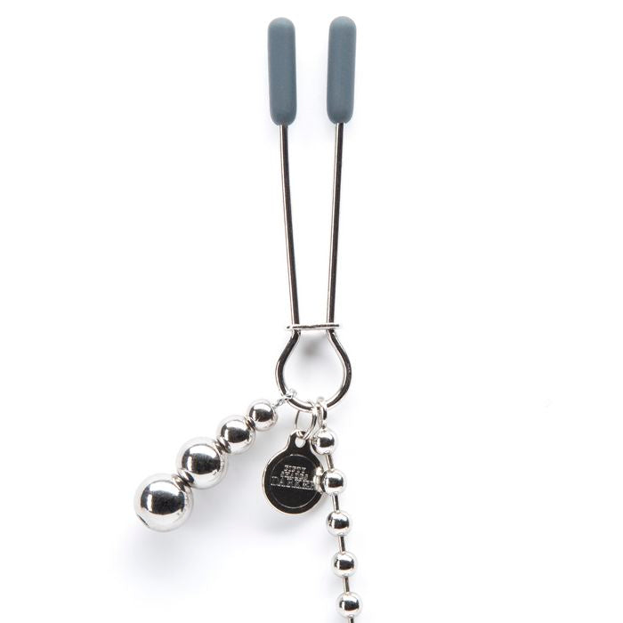 Close-up on one of the Fifty Shades "At My Mercy" clamps. This showcases the small metal piece that can be slid up or down to tighten or loosen the clamp once you get it in place. | Kinkly Shop