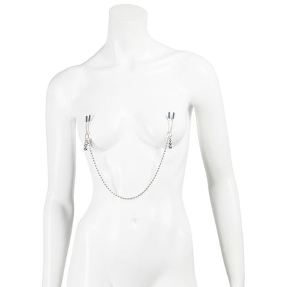 A mannequin wears the Fifty Shades "At My Mercy". A visible chain drapes between the two clamps, attaching them together. | Kinkly Shop