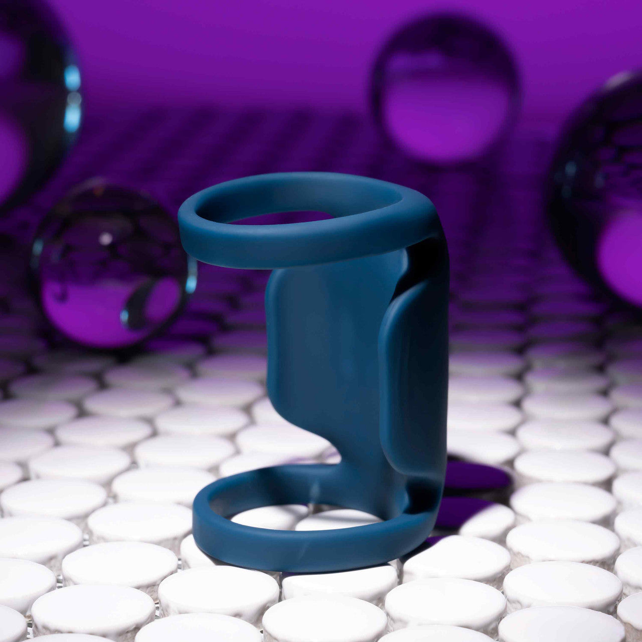 The Playboy Jet Pack sitting upright on a textured surface, showcasing the vibrator's firmness. | Kinkly Shop