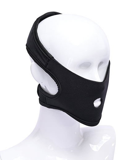 A mannequin head wears the Pivot In Your Face Strap-On. The strap-on harness has two behind-the-head straps to support the weight of the dildo in the front. | Kinkly Shop
