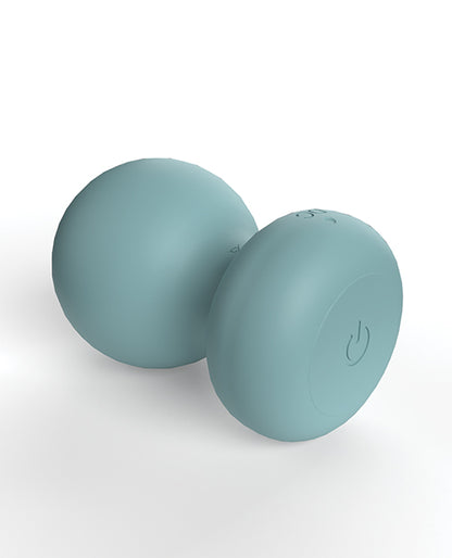 The Screaming O Cuties Palmy lays on its side. The single power/control button on the base is very visible from this angle. | Kinkly Shop