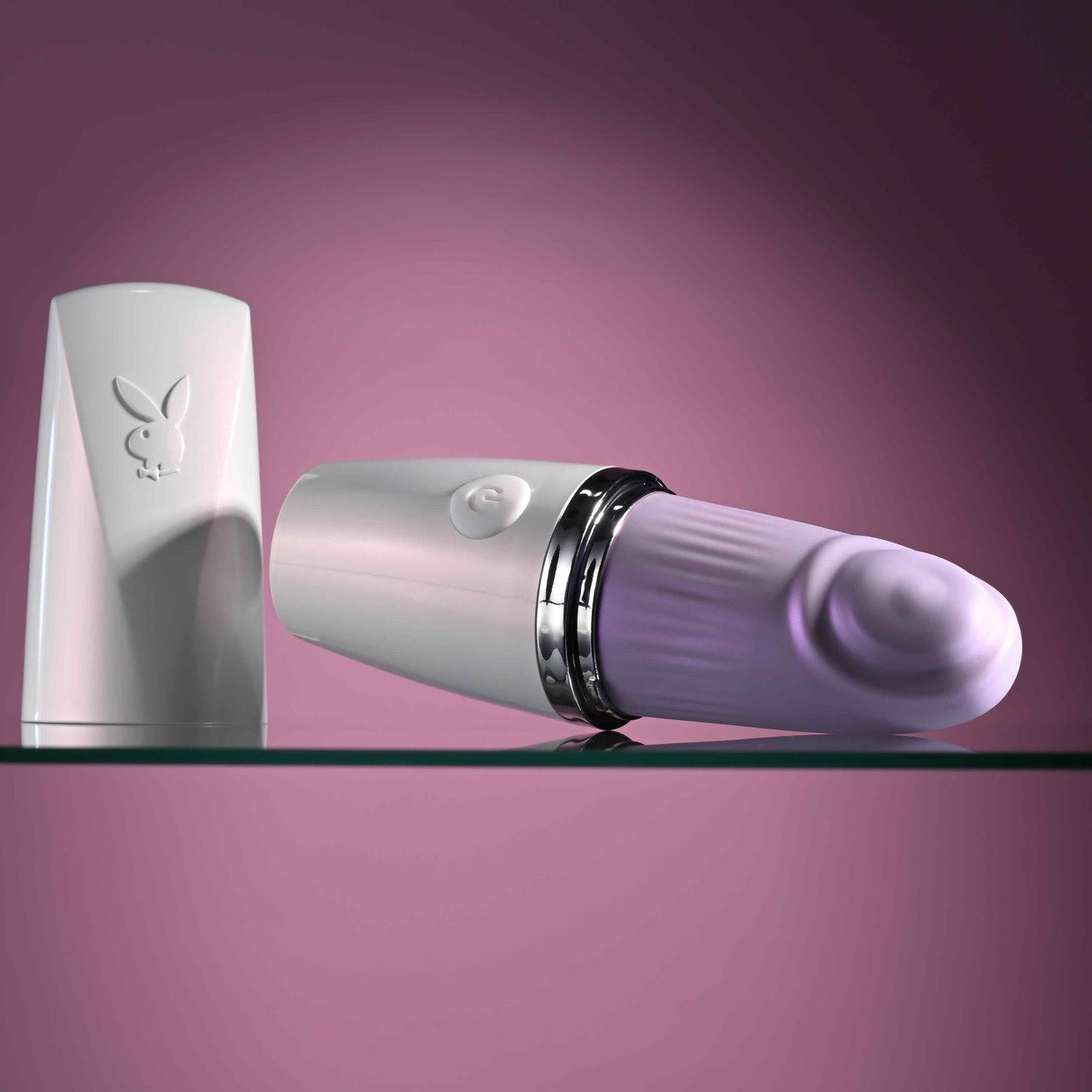 The Playboy Getaway with its lid taken off, showcasing the plastic lid that fits onto the other side of the vibrator. | Kinkly Shop