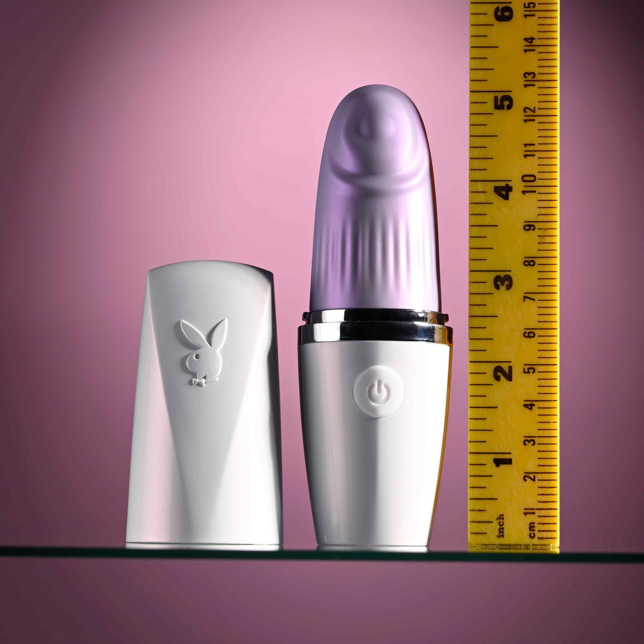 The Playboy Getaway shown next to a yellow measuring tape. The vibrator is bout 5.25" long with the lid on. | Kinkly Shop