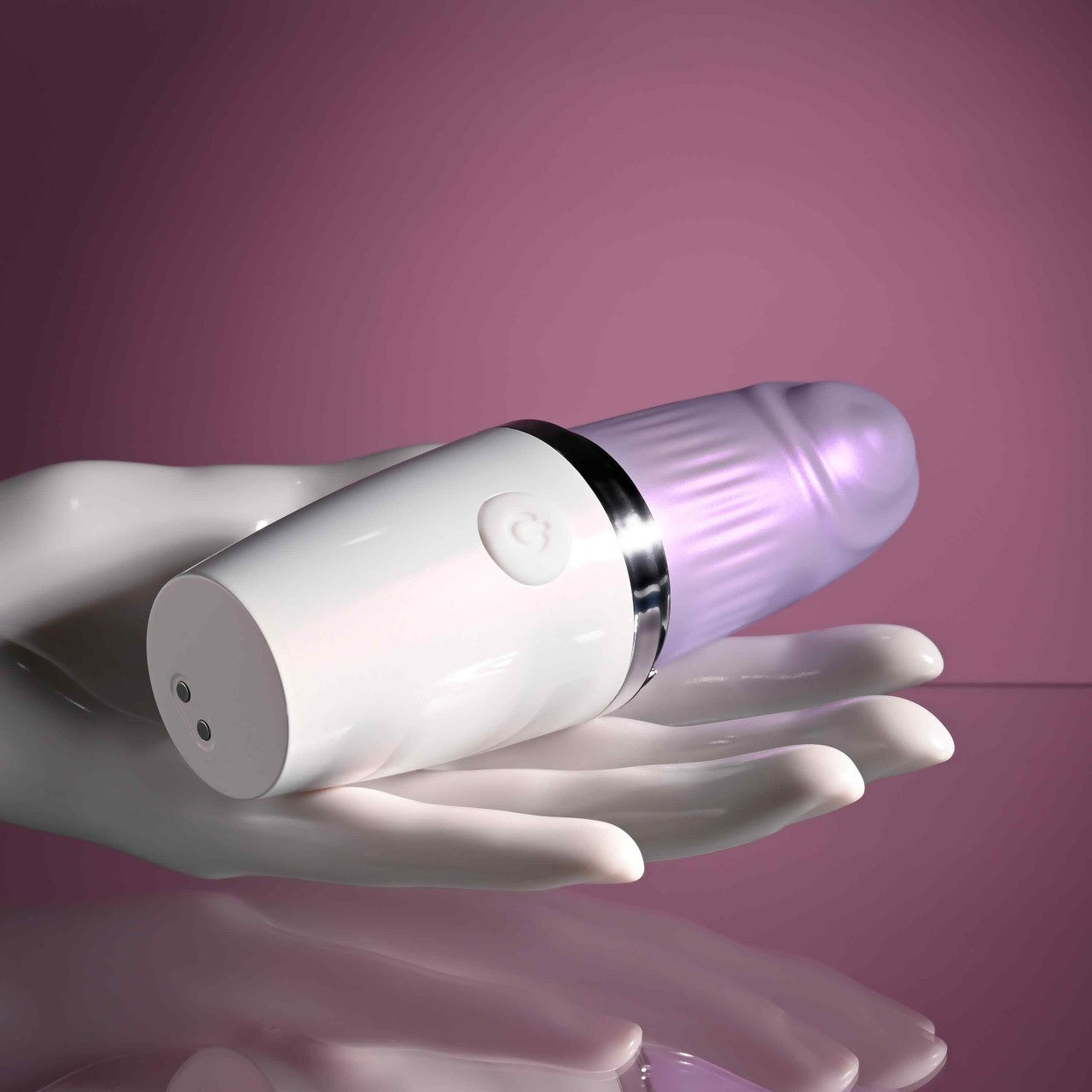 A mannequin hand holds the Playboy Getaway. It's huge compared to the hand at the size of a full-sized vibrator despite its lipstick name. | Kinkly Shop