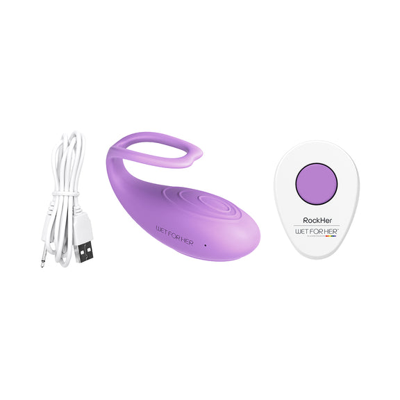 The Wet for Her RockHer 2.0 shown next to everything it comes with. This includes the vibrator, the remote, and the charging cable. | Kinkly Shop