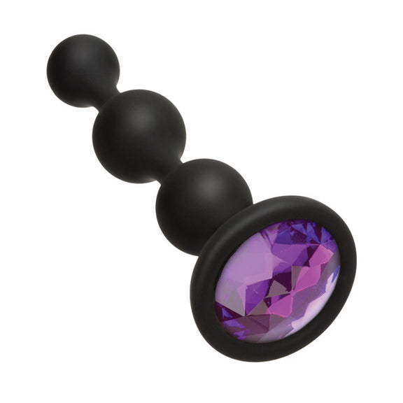 Close-up on the plastic gem that's inlaid inside of the base of the Booty Bling Beads | Kinkly