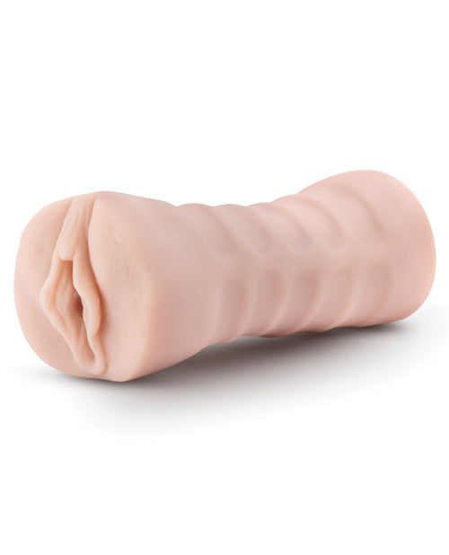 The Blush Ashley shown on its side, showcasing the textured exterior that makes it easier to grip | Kinkly