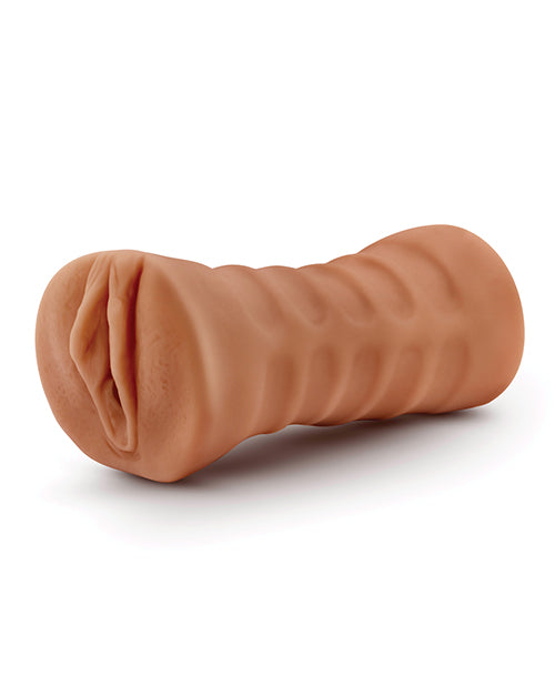 The Blush Julieta shown in front of a plain white background. The exterior of the stroker is really heavily textured for easier gripping to use it. | Kinkly
