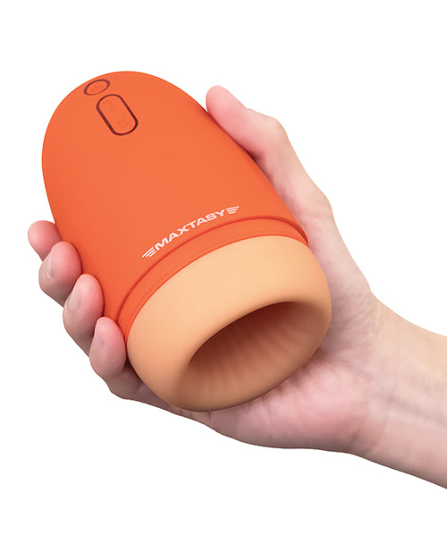 A hand holds the Maxtasy Stamina Master. It fits comfortably into their hand, slightly wider than a large plastic bottle of soda. | Kinkly Shop