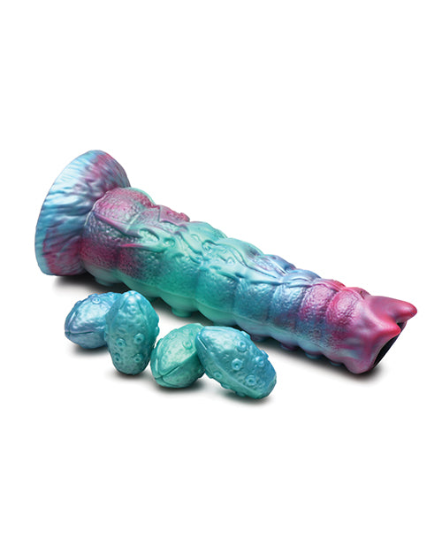 The Creature Cocks Galactic Breeder Ovipositor shown next to all of the eggs that also come with it. | Kinkly Shop