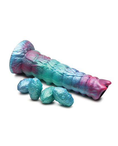 The Creature Cocks Galactic Breeder Ovipositor shown next to all of the eggs that also come with it. | Kinkly Shop
