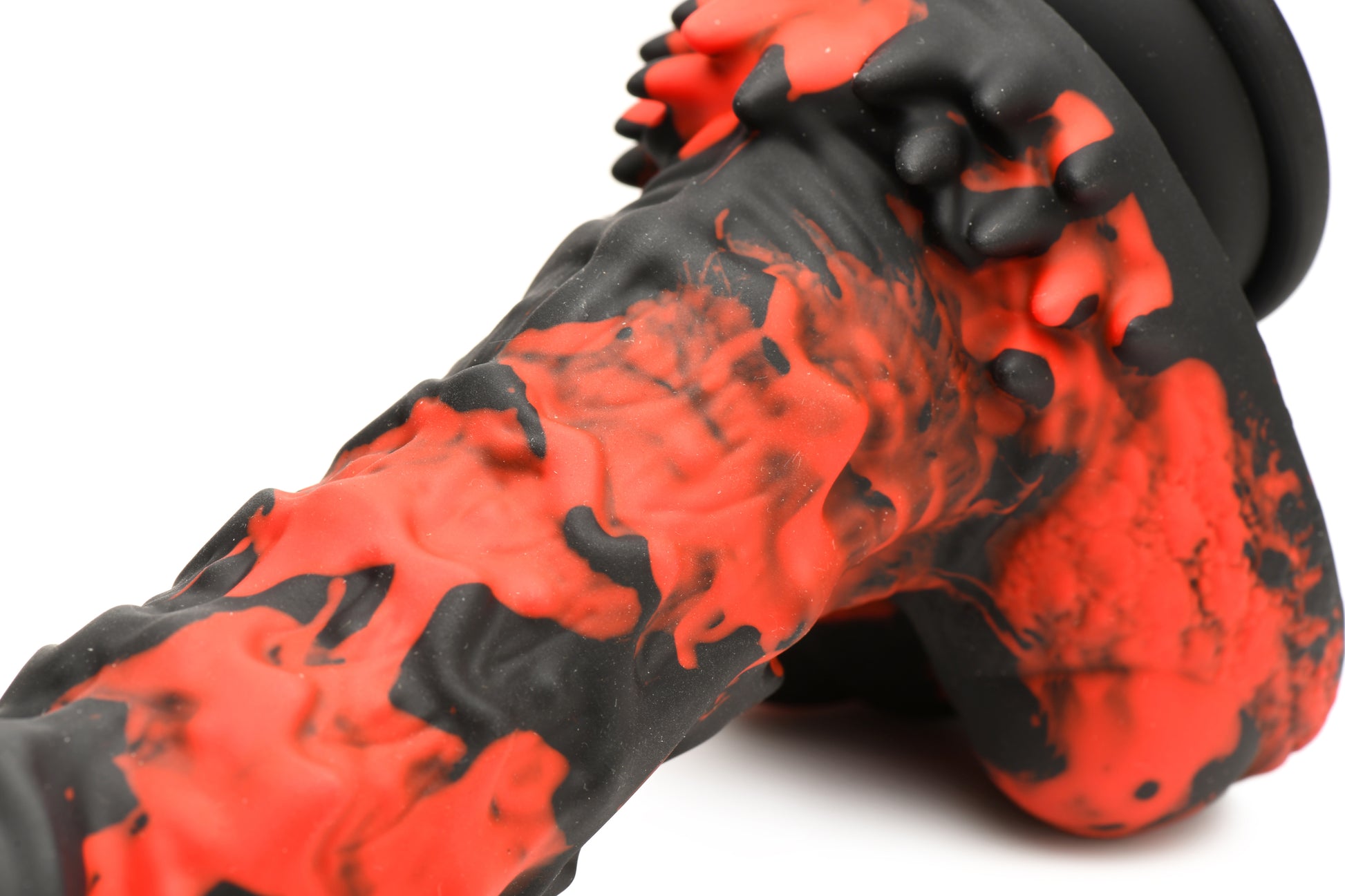 Close-up on the base of the dildo, showcasing the protruding nubs that make up the base for extra sensation. | Kinkly Shop