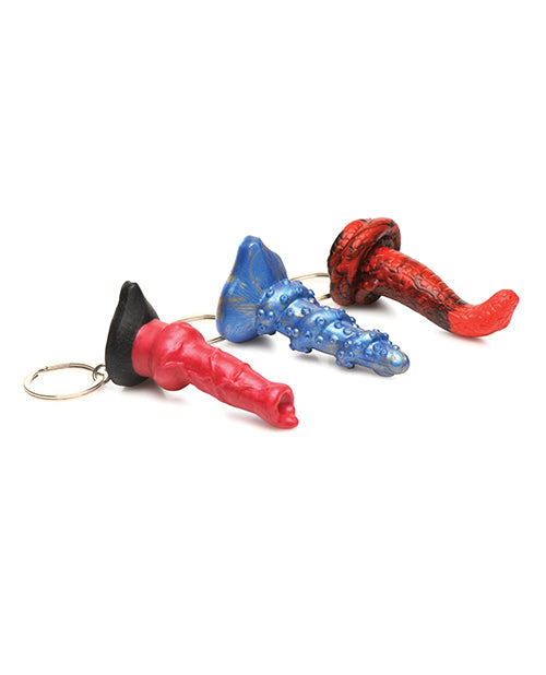 All three keychain items laying on their side. They look like they're made from plastic, but they're made from silicone. | Kinkly Shop