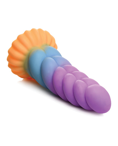 The Creature Cocks Unicorn lays on a flat surface. The rippling texture is very deep. | Kinkly Shop