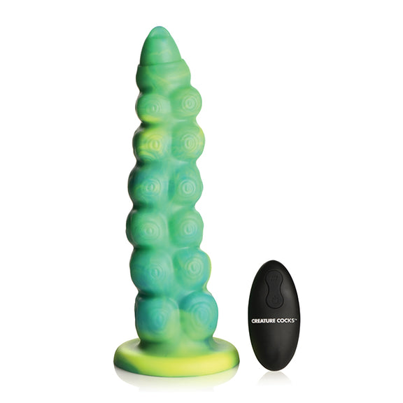 Creature Cocks Squirmer Vibrating Thruster with Remote Control shown next to its remote against a plain white background. | Kinkly Shop