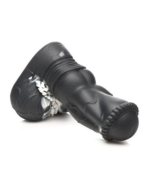 The Creature Cocks Venom laying on its side, showcasing the firm, thick design of the dildo. | Kinkly Shop