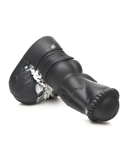 The Creature Cocks Venom laying on its side, showcasing the firm, thick design of the dildo. | Kinkly Shop