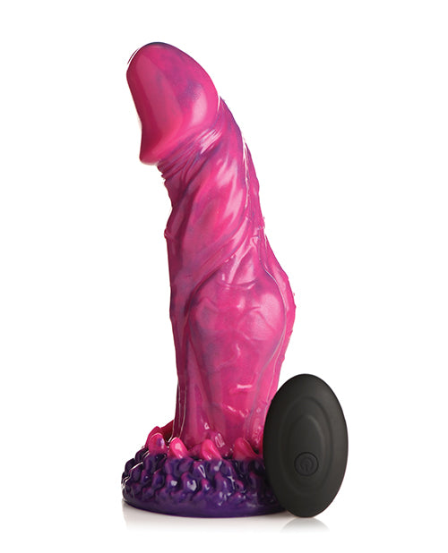 The Creature Cocks Xenox Vibrating Remote-Controlled Dildo shown next to its remote against a white background | Kinkly Shop