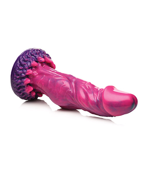 The Creature Cocks Xenox Vibrating Remote-Controlled Dildo rests on its side, showcasing the realistic head, over-the-top veins, and really unique, spike-esque base. | Kinkly Shop