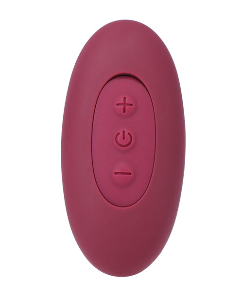 Close-up on the remote for the Tryst Duet. The wireless remote has three buttons on it. | Kinkly Shop