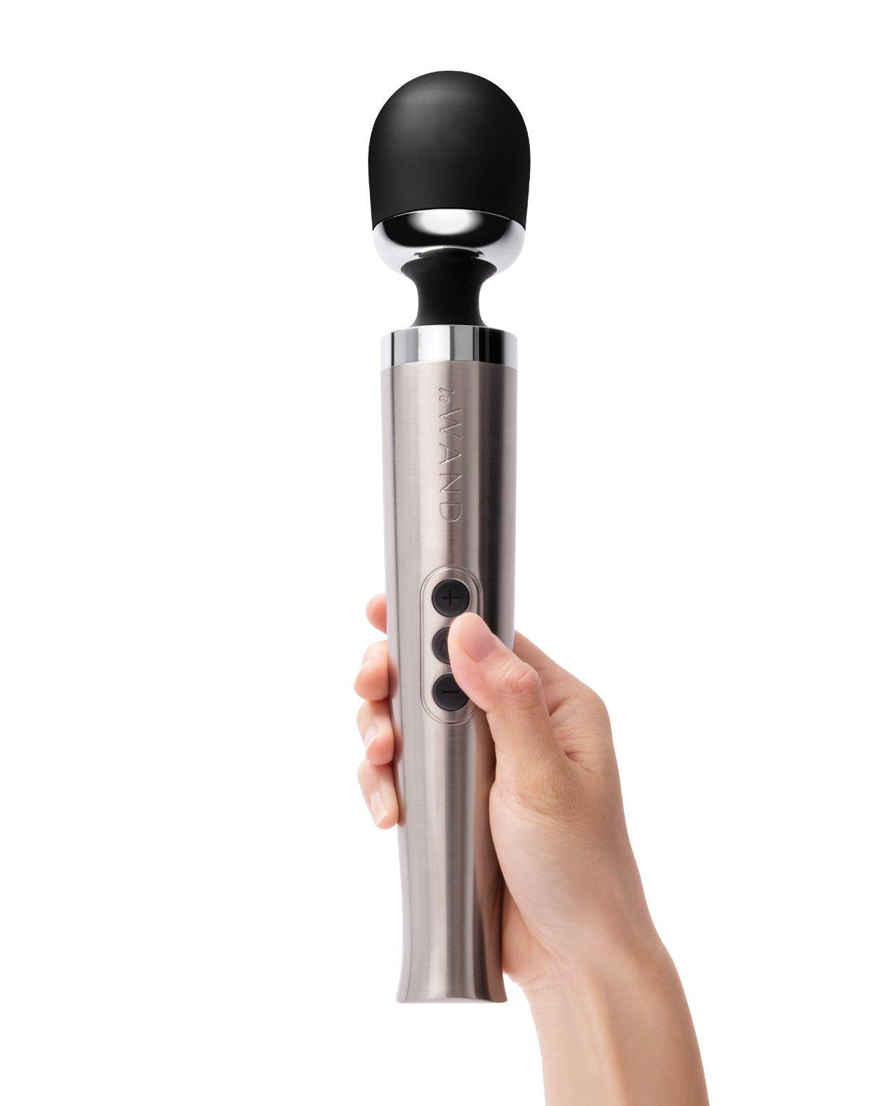 A person holds the Le Wand Die Cast Rechargeable. The vibrator has three buttons easily accessible by the thumb. | Kinkly Shop