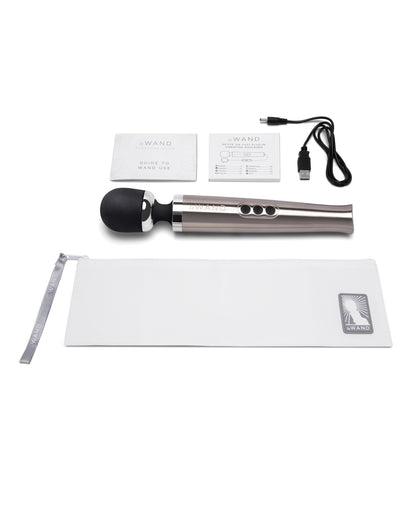 Everything that comes with the Le Wand Die Cast Rechargeable. There's the zippered storage pouch, instructions, the wand itself, and the charging cable. | Kinkly Shop