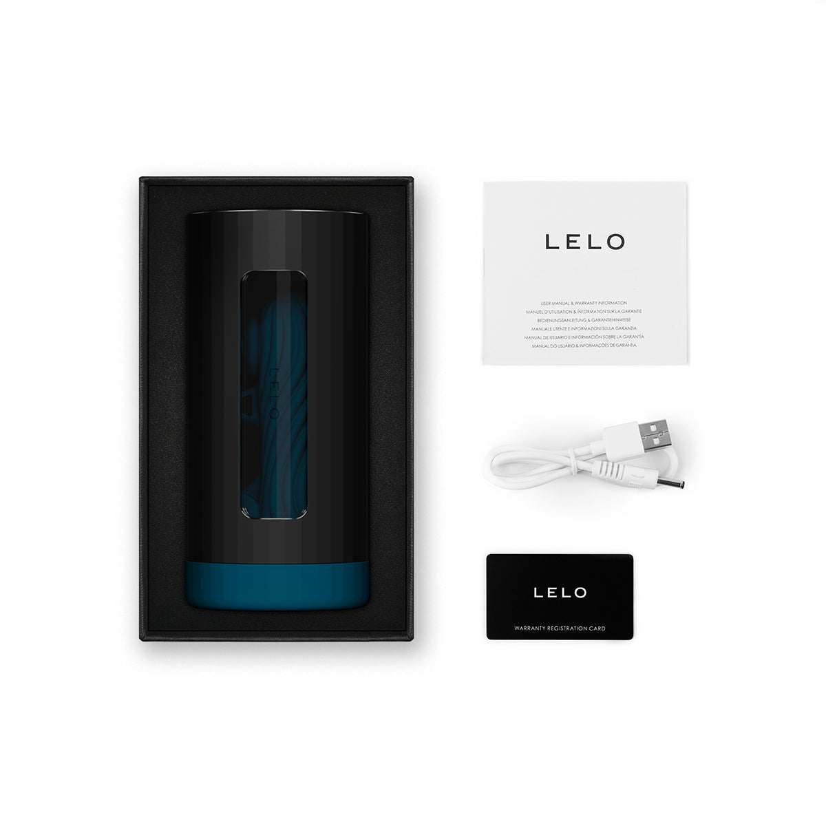 Everything included in the LELO F1S V3 including the stroker, warranty, instruction manual, and charging cable. | Kinkly Shop