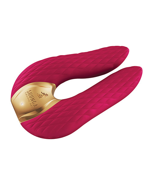 The Shunga Aiko in Raspberry. The LED light at the base of the vibe is turned on, shining at the base of the toy. | Kinkly Shop
