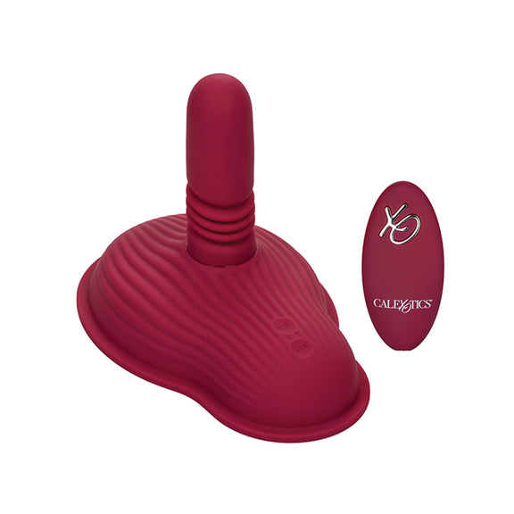 The Dual Rider Thrust and Grind shown next to the wireless remote control that comes with it | Kinkly