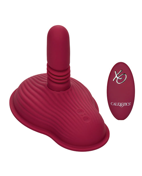 The Dual Rider Thrust and Grind shown next to the wireless remote control that comes with it | Kinkly