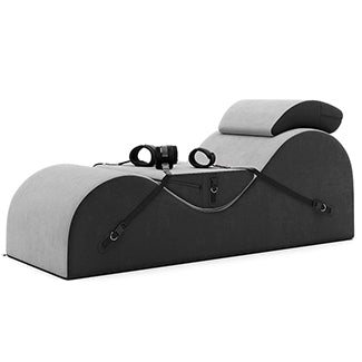 BDSM chaise lounge in dual-tone gray and black with bondage accessories and ergonomic curves for sex dungeon furniture ideas