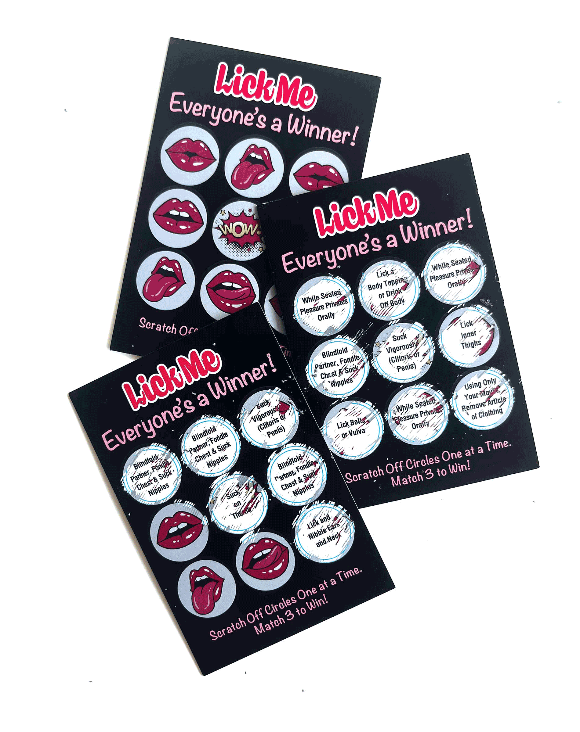 Kinky Lotto Tickets shown with some of the prompts scratched off, showcasing some of the ideas underneath the scratch-off designs. | Kinkly Shop