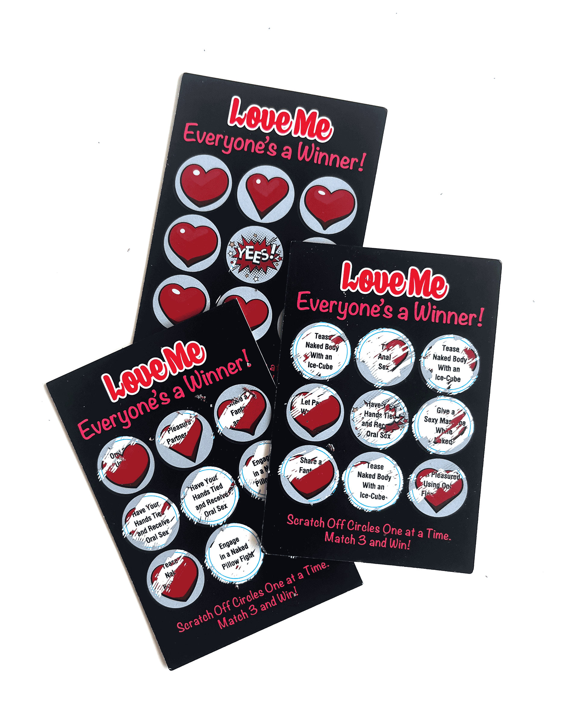 Kinky Lotto Tickets shown with some of the prompts scratched off, showcasing some of the ideas underneath the scratch-off designs. | Kinkly Shop