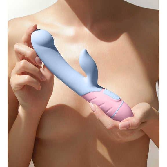 A shirtless person uses both of their hands to present the FemmeFunn FFIX Rabbit to the camera. The vibrator looks silky smooth to the touch. It looks like it's an average biological penis width at about 2 to 3 fingers in insertable width. The textured base looks easy to grasp. | Kinkly Shop